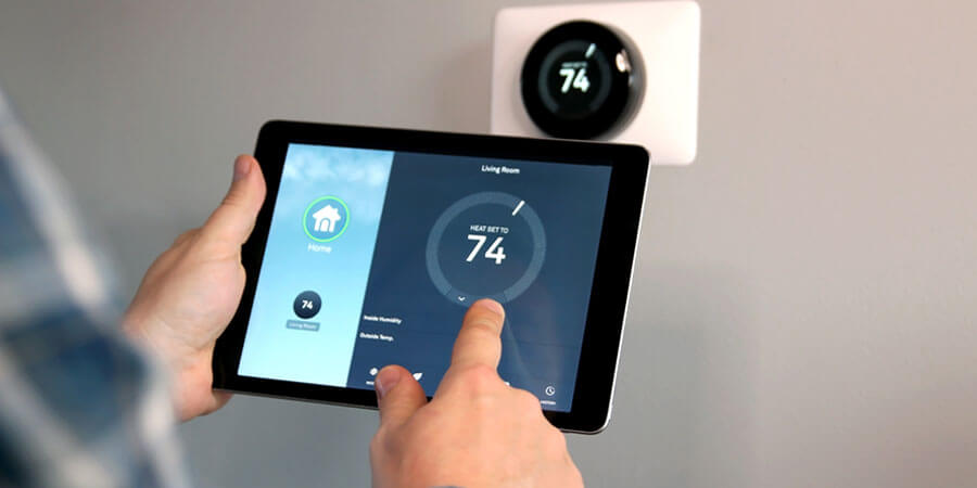 Person controlling thermostat
